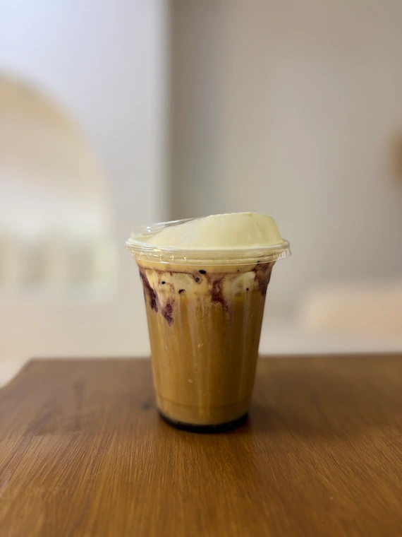 an iced chai with vanilla cold foam